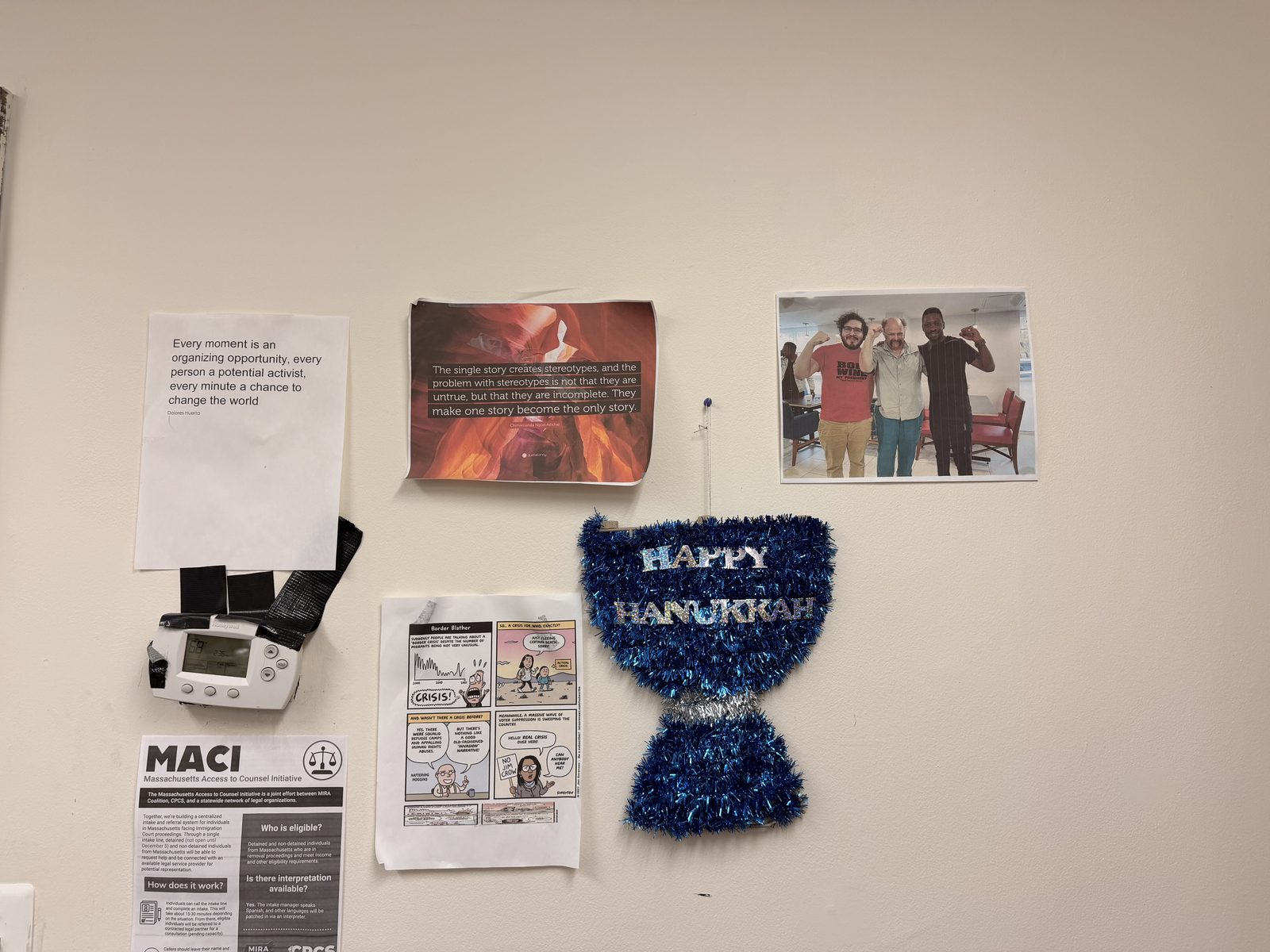 Quotes, community photos, legal resources, and seasonal decorations in the TRII office